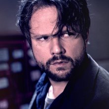 O Mecanismo: un primo piano di Selton Mello in una scena