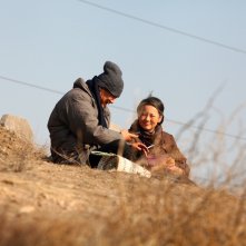 So Long, My Son: Yong Mei e Wang Jingchun in una scena del film