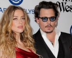 Amber Heard risponde a Johnny Depp: ecco perché non ha ancora donato i soldi del divorzio