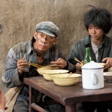 One Second, una scena del film di Zhang Yimou