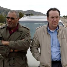 Running With the Devil: Laurence Fishburne e Nicolas Cage in una scena del film