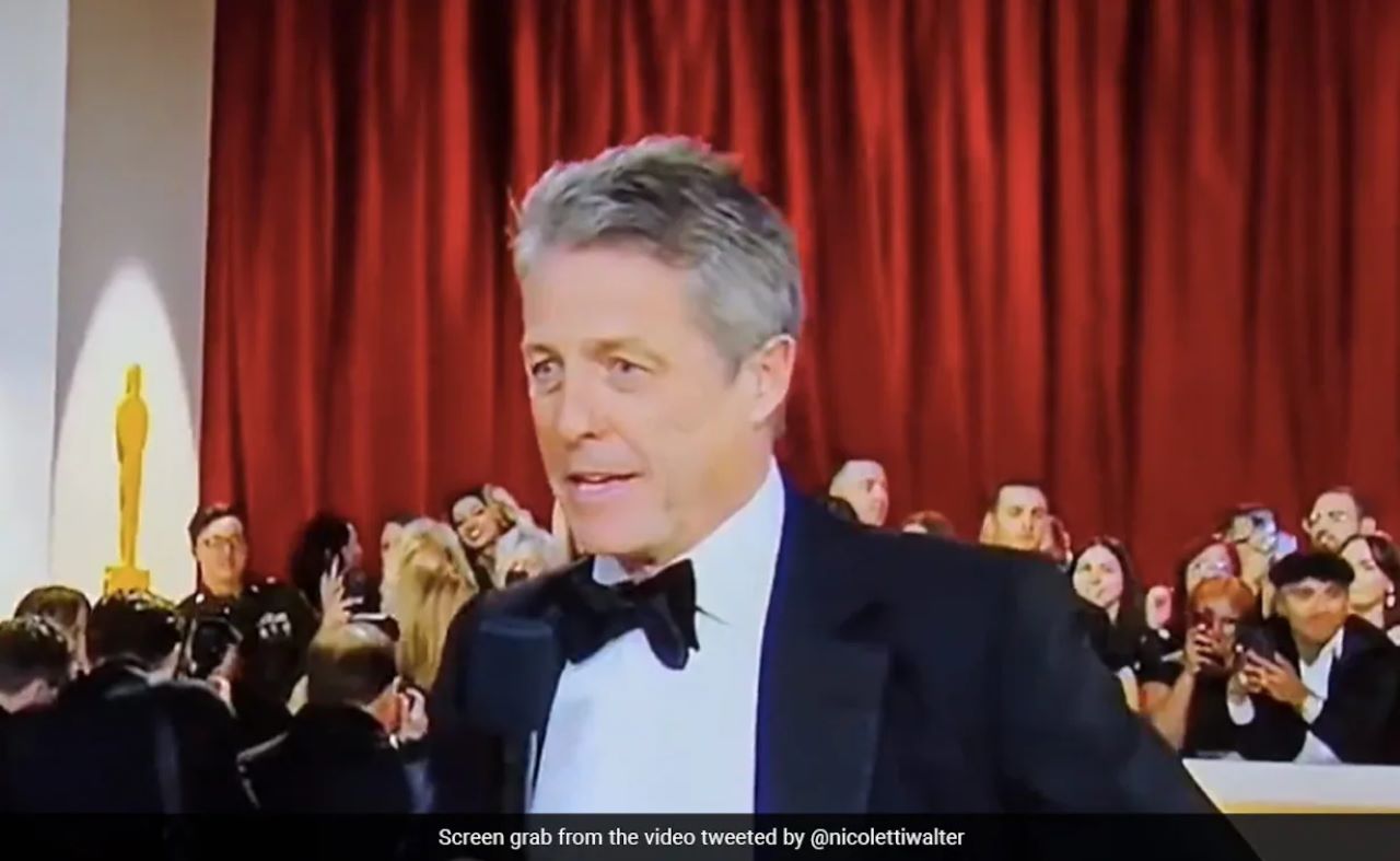 Oscar 2023, Hugh Grant imbarazzante: risponde annoiatissimo all'intervista 'Indosso il mio vestito'
