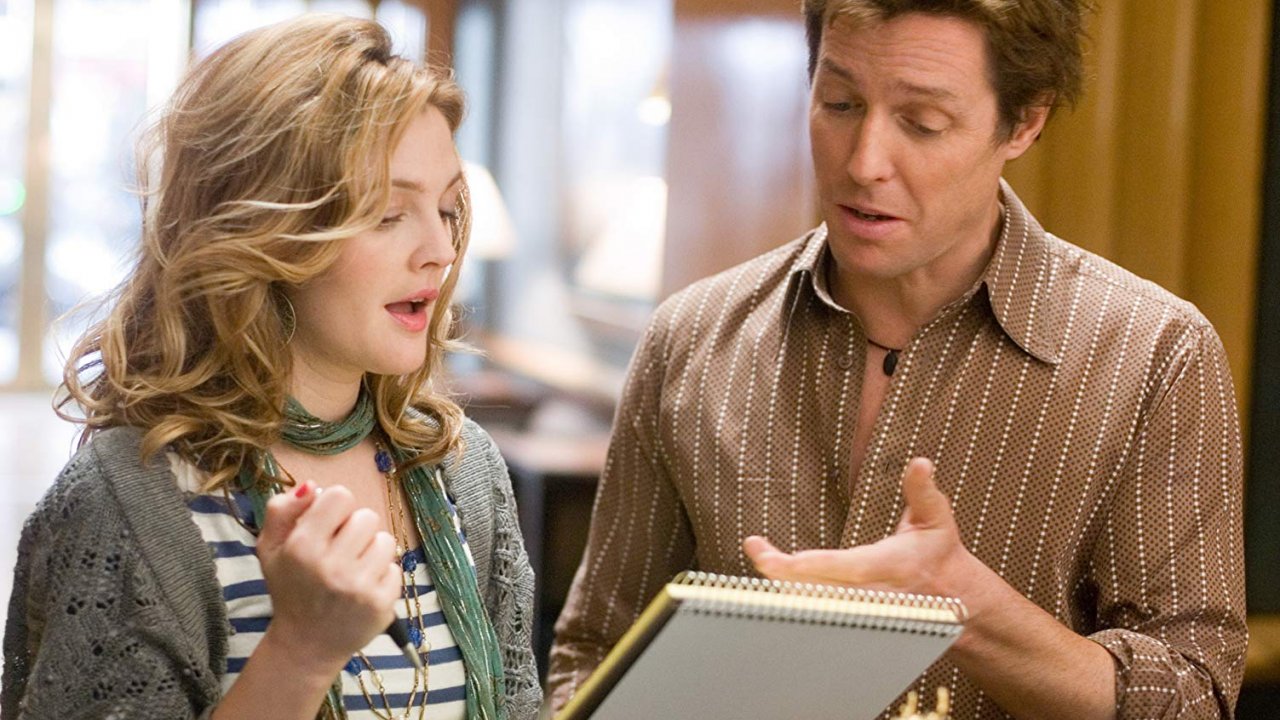 Hugh Grant insults Drew Barrymore's singing and the actress responds in kind