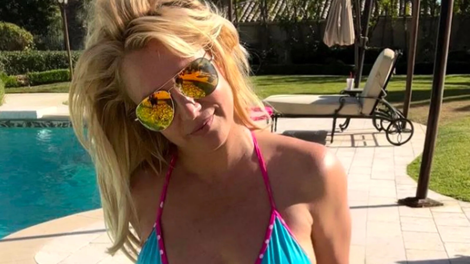 Britney Spears dances topless in a new video posted to Instagram just days after her divorce.