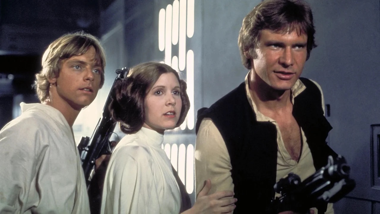 Mark Hamill, Carrie Fisher ed Harrison Ford in una scena di Star Wars.