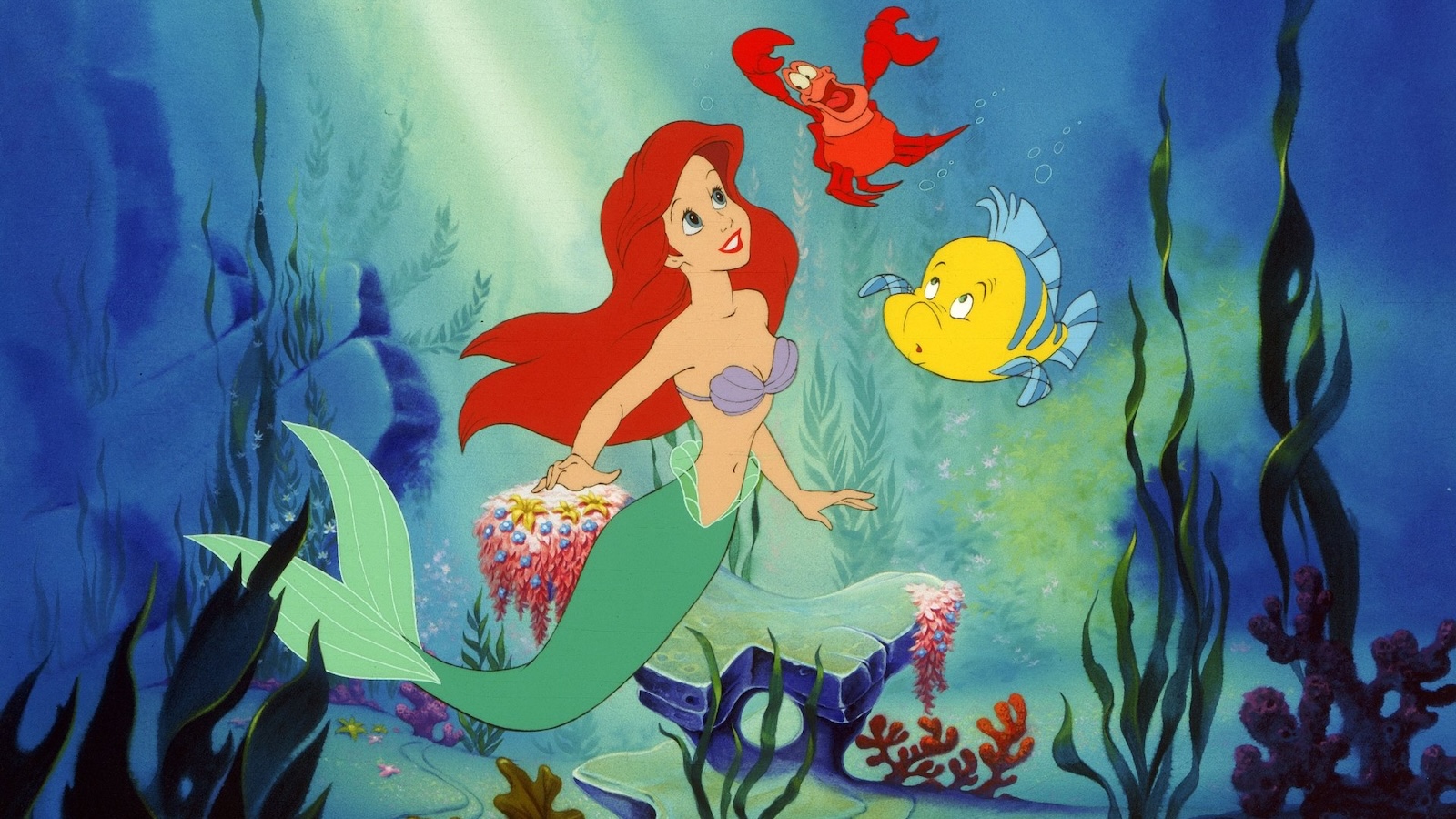 Ariel, Sebastian e Flounder in una scena de La sirenetta